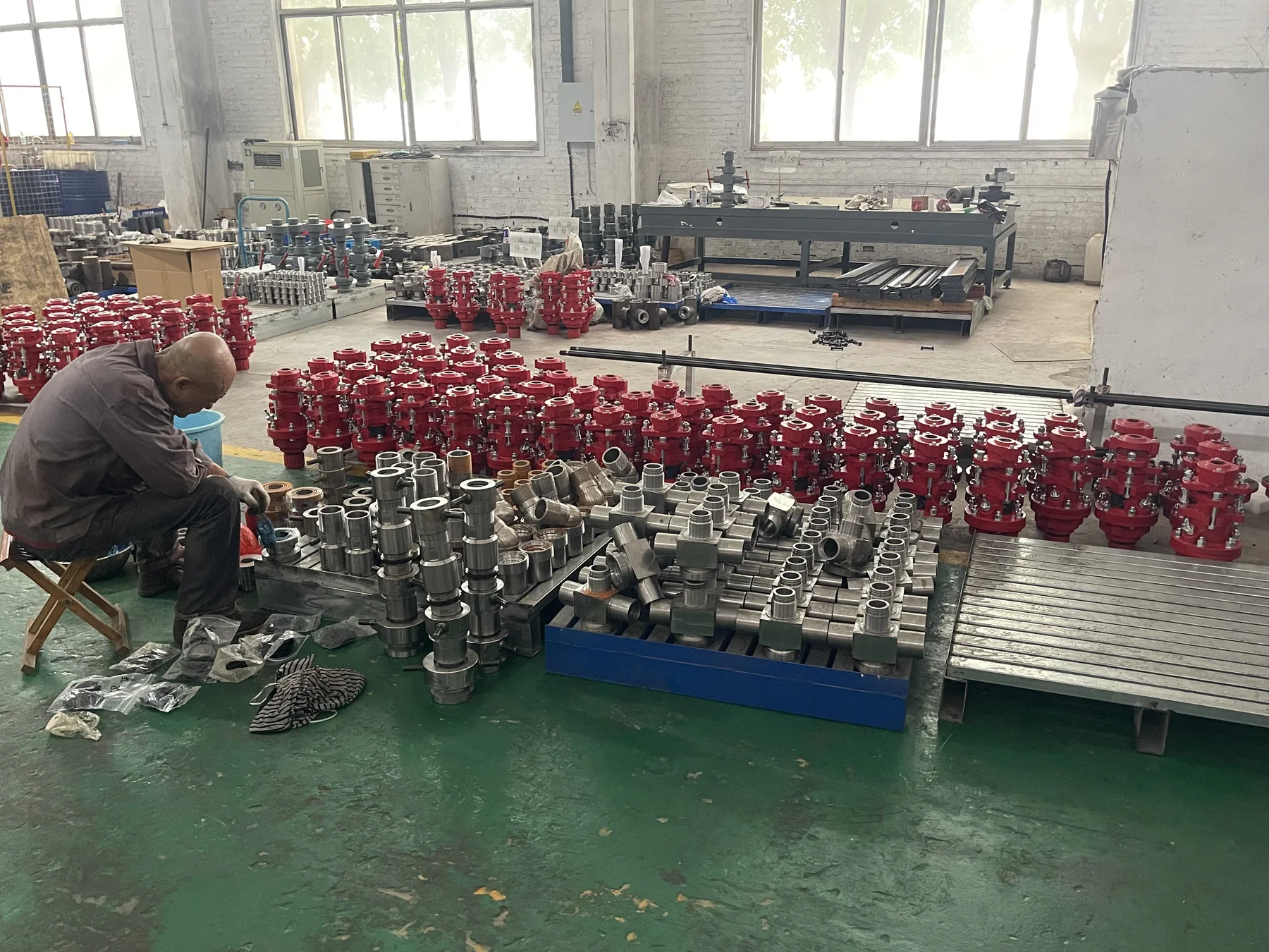 Technician assembling oilfield components