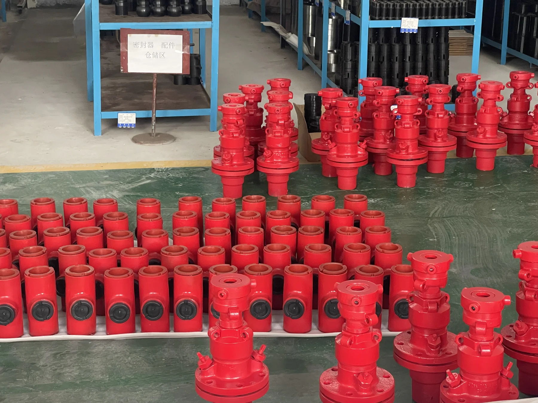 Red finished components arranged by batch