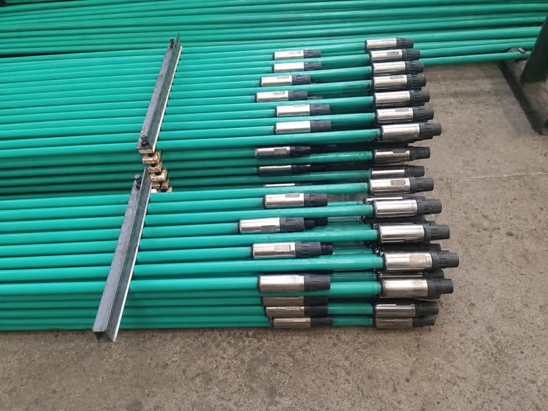 Fully encapsulated sucker rods with metal threaded connectors